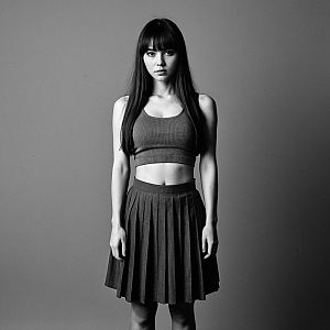 Black and White Portrait of Woman in Crop Top and Skirt
