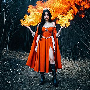 Mystical Woman in Fiery Orange Gown in Dark Forest