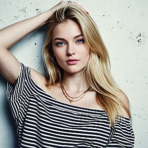 Confident Blonde Woman in Striped Top