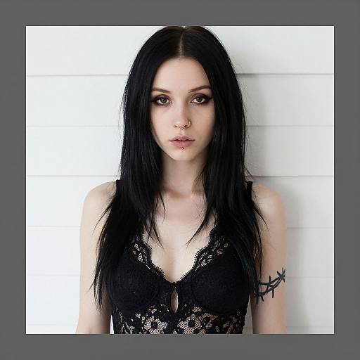 Young Woman with Black Hair and Lace Top Featuring Barbed Wire Tattoo
