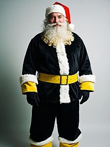 Man in Black and Yellow Santa Suit with Classic White Fur Trim