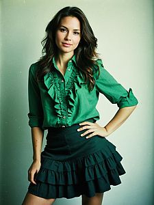 Portrait of Woman in Green Ruffle Blouse and Black Ruffle Skirt