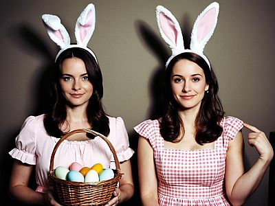 Two Women in Bunny Ears with Easter Eggs Basket and Pink Dresses