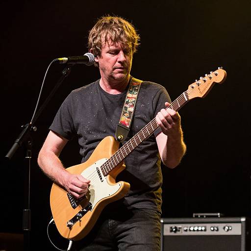 Male Guitarist Performing on Stage