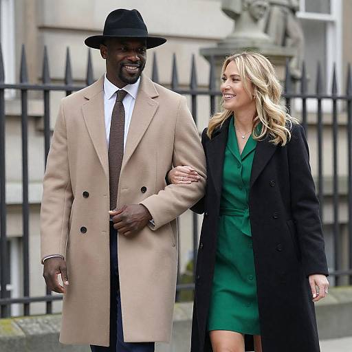 Smiling Couple Strolling by Stone Building