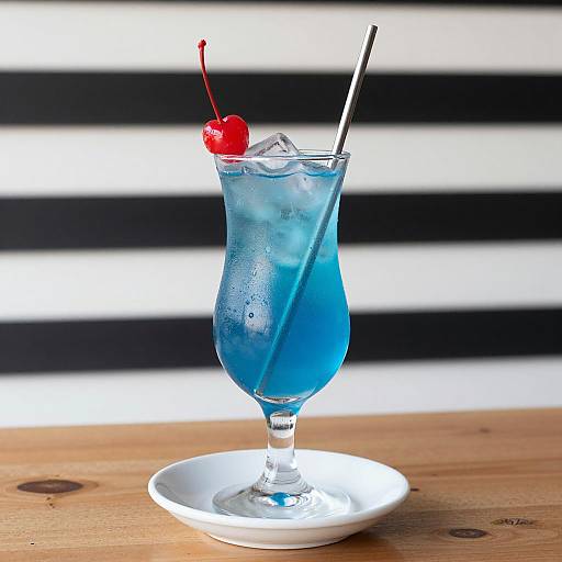 Elegant Blue Cocktail Photography with Cherry