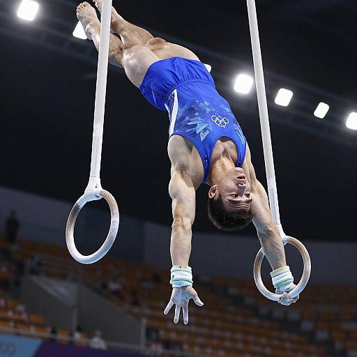 Dynamic Iron Cross Performance by Male Gymnast