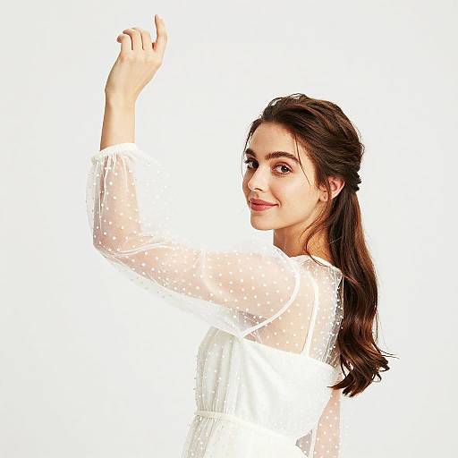 Elegant Woman in Sheer Polka-Dot Dress