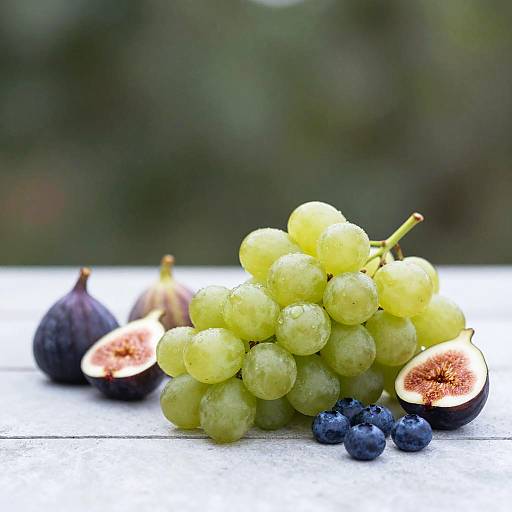 Fresh green grapes with figs and blueberries