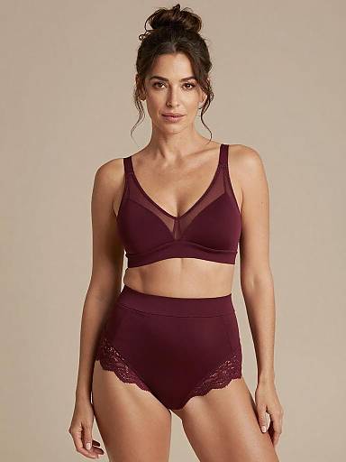 Confident Woman in Burgundy Maternity Lingerie Set
