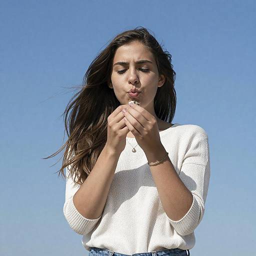 Serious Woman in White Knit Top