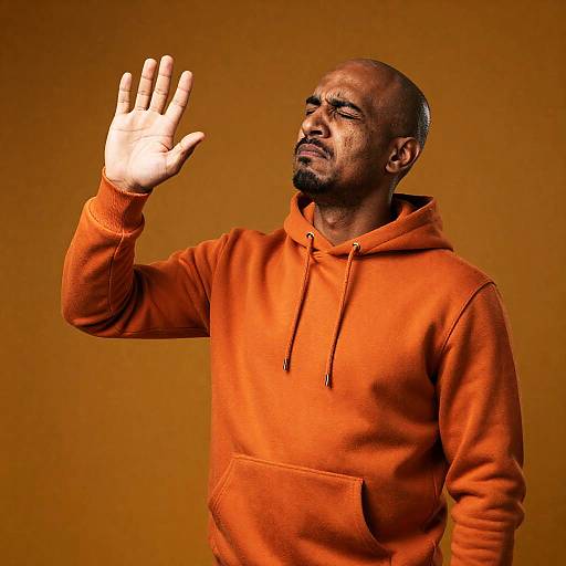 Bald Dark-Skinned Man Waving, Disgusted