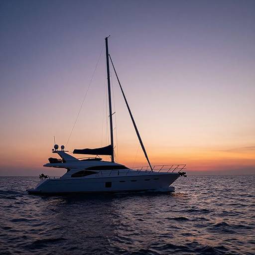 Photograph of a white sailboat silhouetted against a vibrant sunset, with a gradient sky from purple to orange, floating on calm, dark