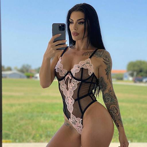 Tattooed Woman in Floral Lingerie Selfie