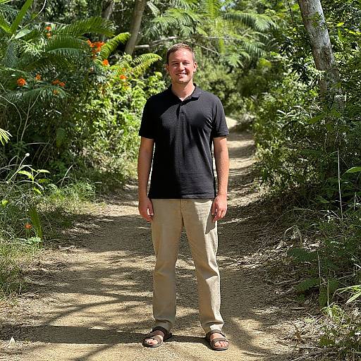 Smiling Man on Sunlit Forest Path