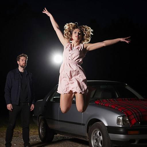 Joyful Woman Jumping at Night