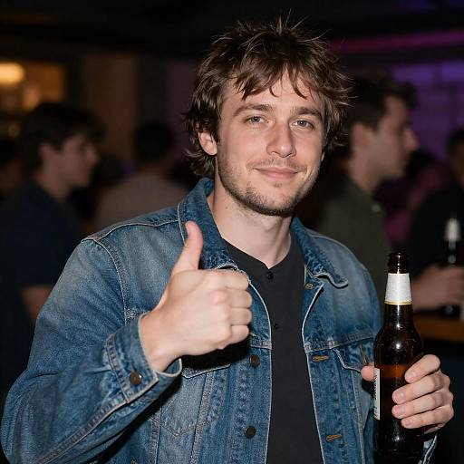 Smiling Man in Denim Jacket with Beer