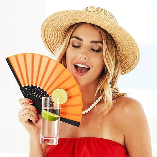 Woman in Straw Hat Holding Drink and Fan