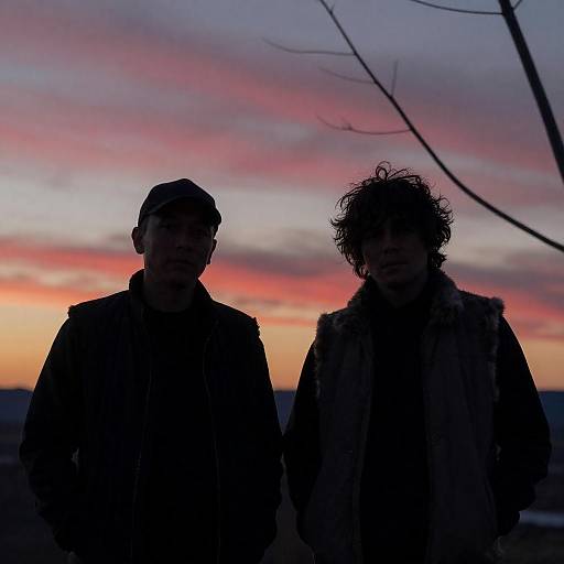 Silhouetted Men at Colorful Sunset