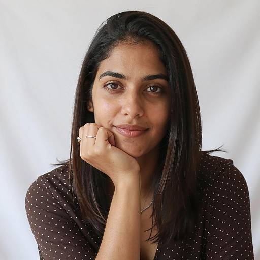 Calm Young Woman Resting Chin on Hand