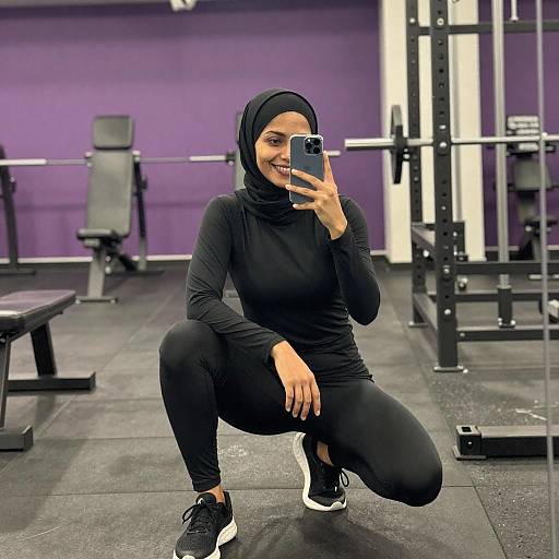 Smiling Woman in Hijab Gym Selfie