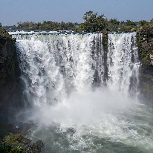 Majestic Waterfall Over Rocky Cliff