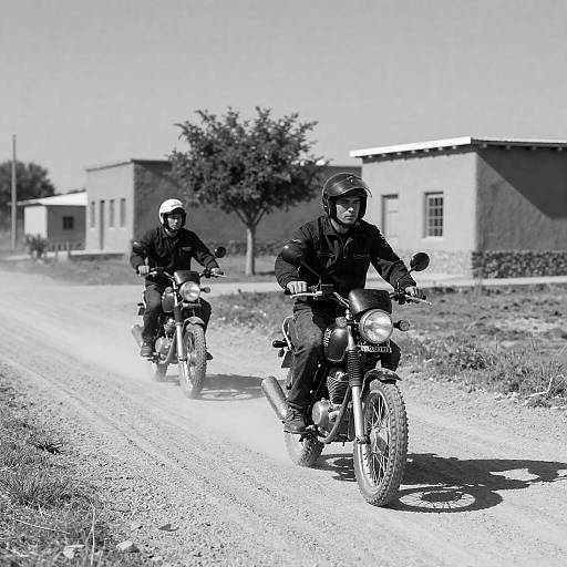Motorcyclists on a Sunlit Gravel Path