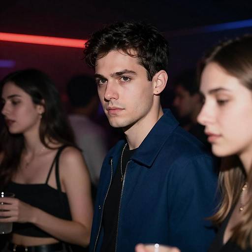 Young Man in Nightclub with Neon Lighting