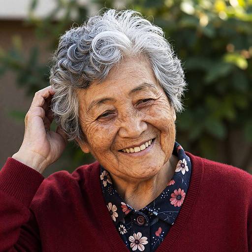 Cheerful Elderly Woman in Sunlit Garden