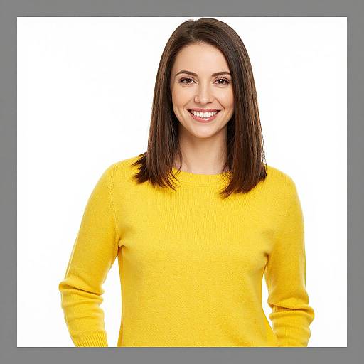 Photograph of a smiling woman with straight, dark brown hair wearing a bright yellow sweater, set against a white background.