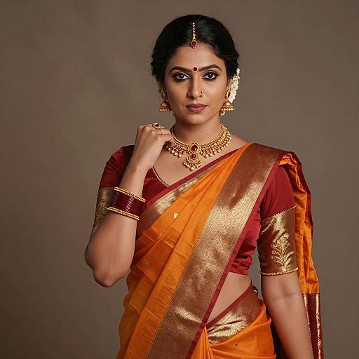Indian Woman in Traditional Red and Orange Silk Saree