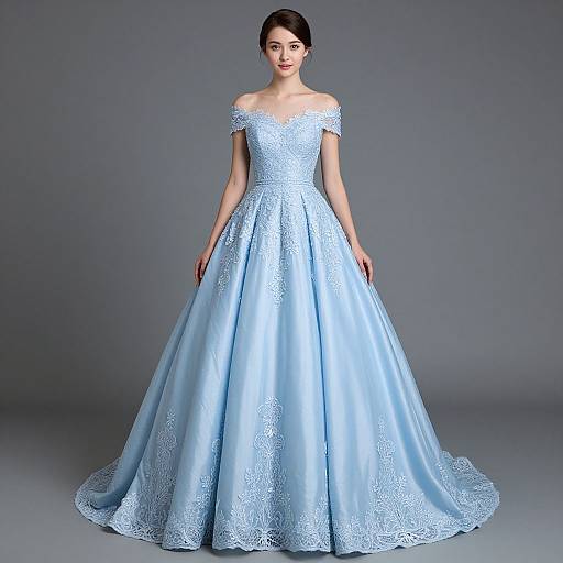 Photograph of an elegant Asian woman in an off-shoulder, light blue satin ball gown with intricate lace detailing, standing against a plain gray background