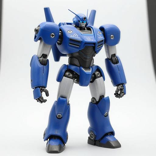 Photograph of a detailed, blue and silver robot with angular armor, black chest, and gray joints, standing against a white background.