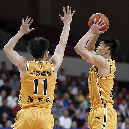 Two Players in Yellow Jerseys Action