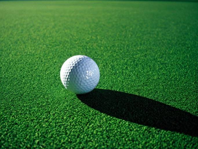 Golf Ball on Green Wallpaper Design