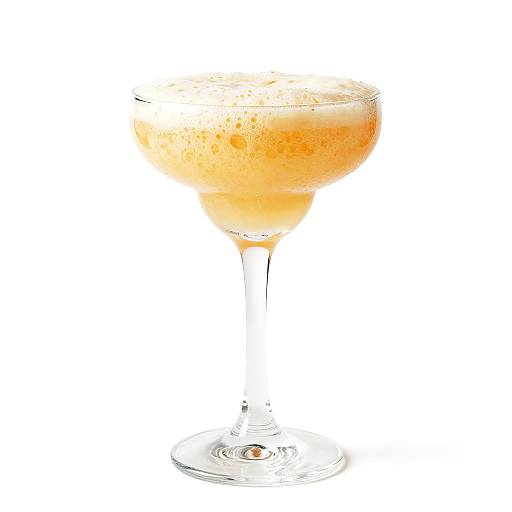 Frothy Light Orange Cocktail Glass