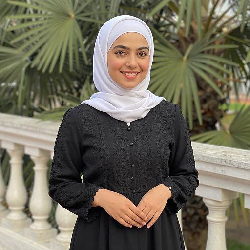 Smiling Woman in White Hijab Outdoors