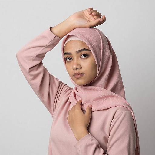 Thoughtful Young Woman in Pink Hijab