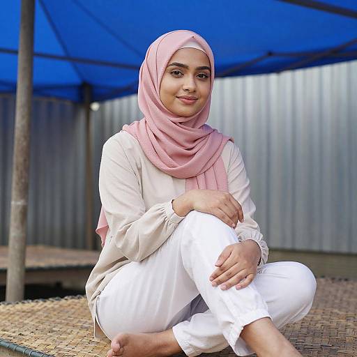 Young Woman in Pink Hijab Sitting