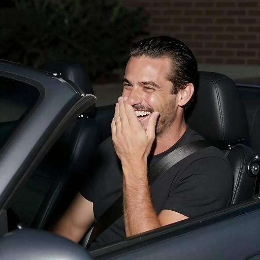 Laughing Man in Convertible at Night