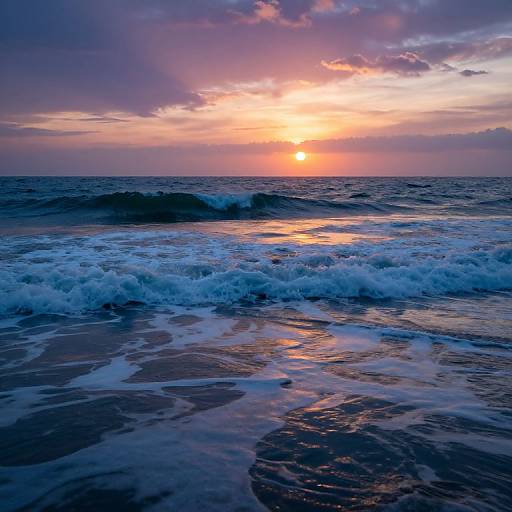 Photograph of a vibrant sunset over a crashing ocean wave with deep blue water, foamy white waves, and a colorful sky.