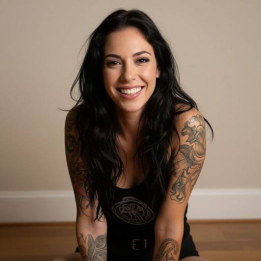 Smiling Woman with Wavy Hair and Tattoos