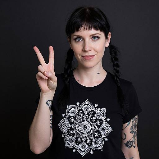 Smiling Woman with Tattoos and Peace Sign