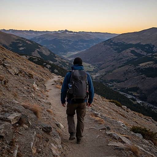 Hiker on Mountain Trail at Sunset