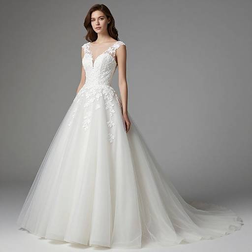 Photograph of a slender woman with wavy brown hair wearing a white, lace-embellished, sleeveless wedding gown with a deep V-neck