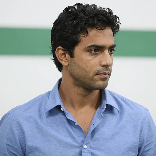 Man in Light Blue Shirt Looking Right