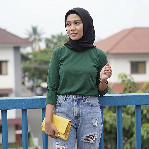 Asian Woman in Hijab on Balcony