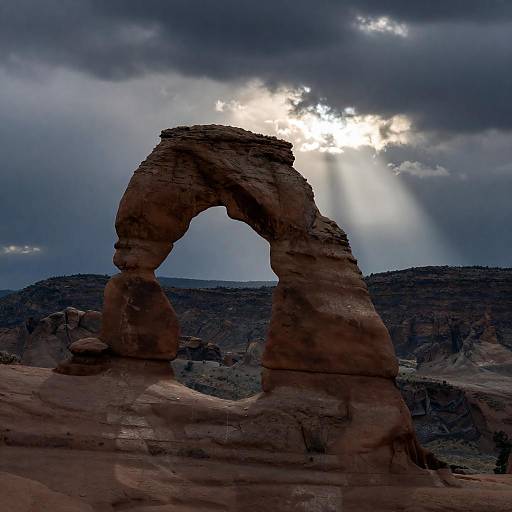 Dramatic Rocky Arch Under Stormy Sky