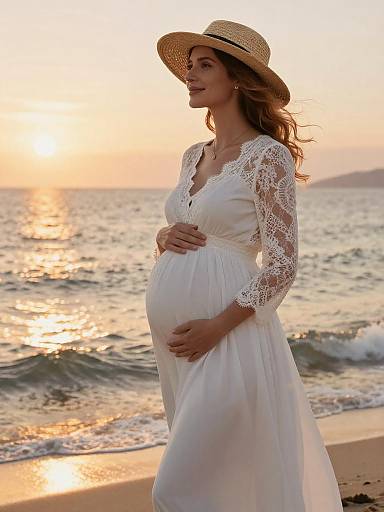 Pregnant Woman in White Dress by Ocean at Sunset
