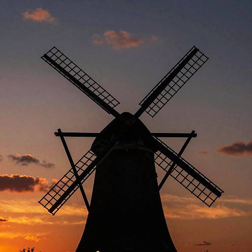 Silhouetted Windmill at Vibrant Sunset